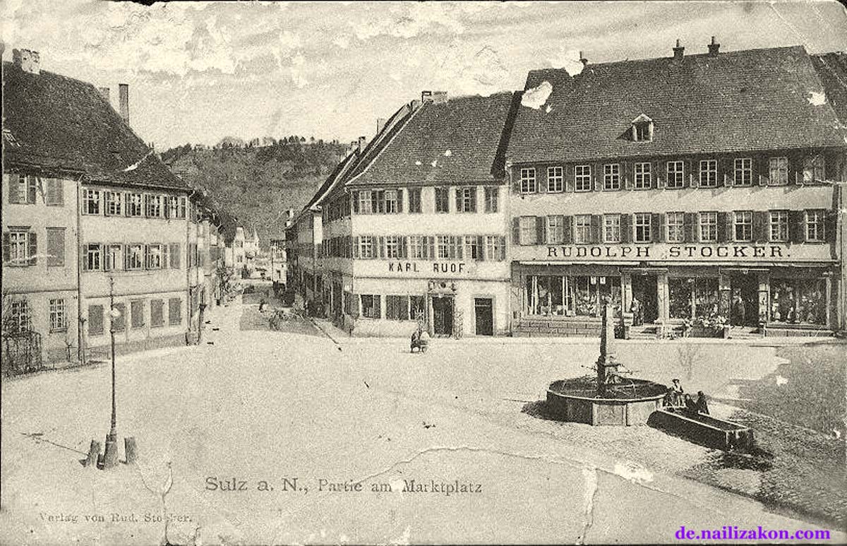 Sulz am Neckar. Marktplatz, Geschäften von Karl Ruof und Rudolph Stocker, Brunnen, 1911