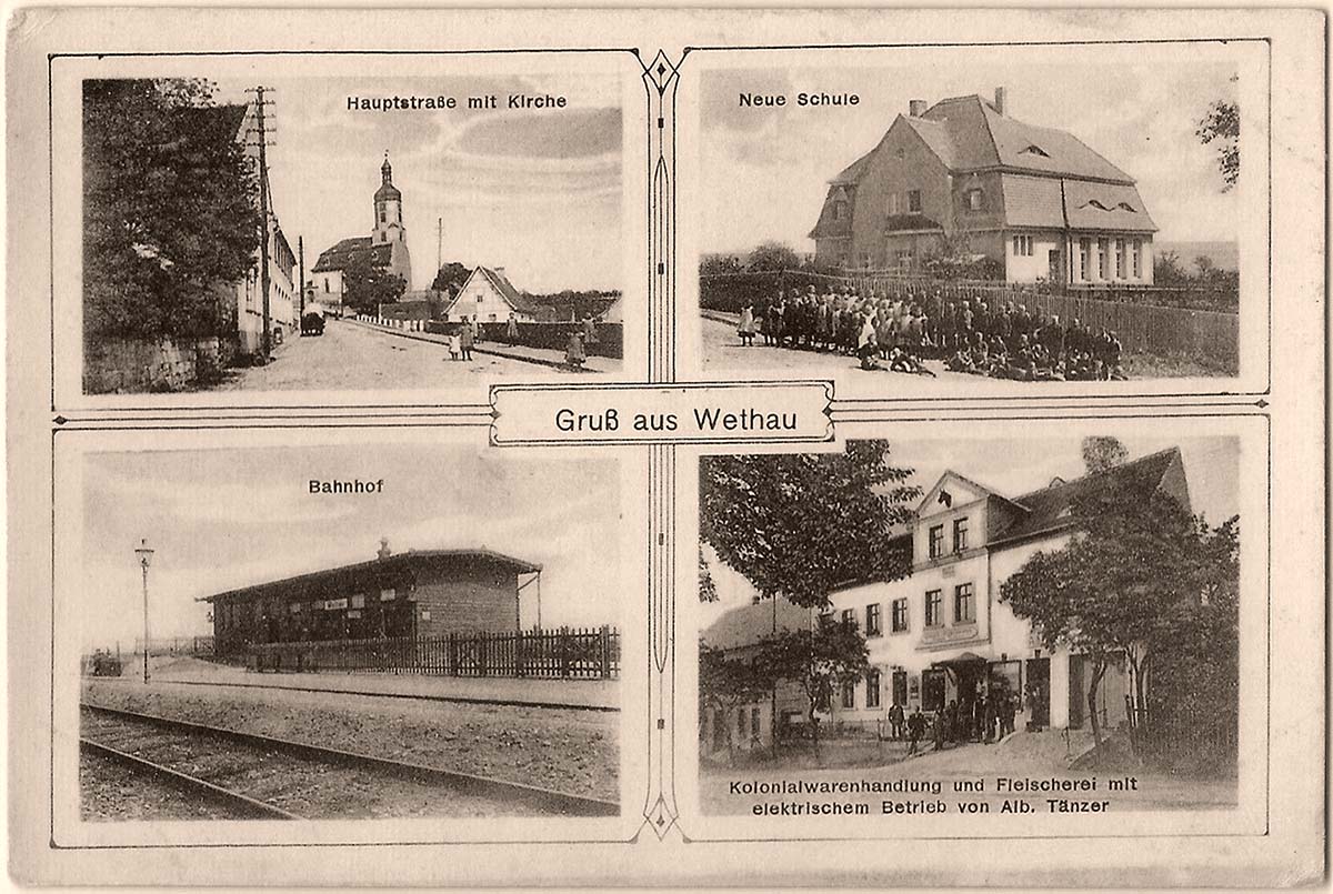 Wethau. Hauptstrasse mit Kirche, Neue Schule, Bahnhof und Kolonialwarenhandlung, um 1910